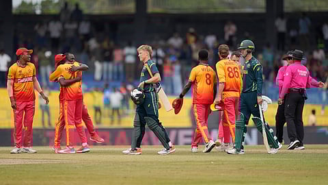 Zimbabwe players celebrate after winning the T20 World Cup cricket match against Australia in Colombo, Sri Lanka, Friday, Feb. 13, 2026.