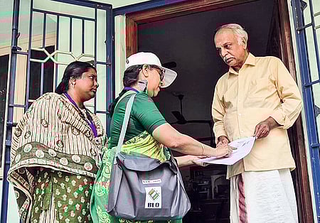 A Special Intensive Revision (SIR) officials during the house-to-house verification process to update voter list