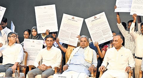 Chief Minister Siddaramaiah, Health Minister Dinesh Gundu Rao and MLA Rizwan Arshad at the ‘Abhaya Hasta’ event in Bengaluru on Saturday 