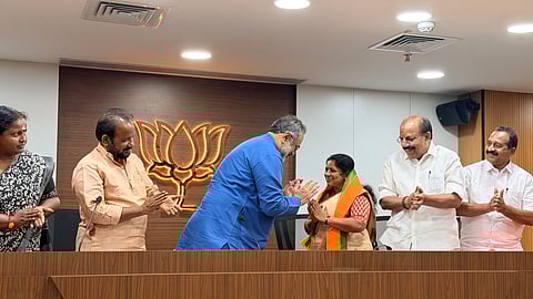 Mahila Congress leader R Resmi being welcomed to the BJP by party state president Rajeev Chandrashekhar in Thiruvananthapuram on Saturday.