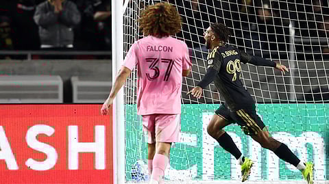Los Angeles FC forward Denis Bouanga (99) celebrates after scoring a goal as Inter Miami defender Maximiliano Falcón (37) watches during the second half of an MLS soccer match, Saturday, Feb. 21, 2026, in Los Angeles, Calif.