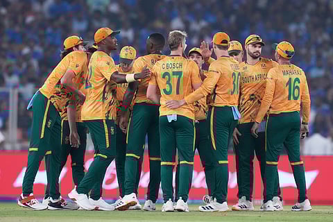 South Africa's players celebrate the wicket of India's Washington Sundar during the T20 World Cup cricket match between India and South Africa in Ahmedabad, India, Sunday, Feb. 22, 2026. 