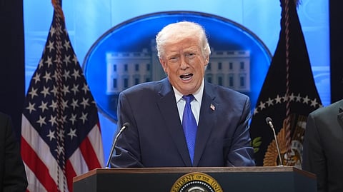 Donald Trump speaks during a press briefing at the White House on Friday