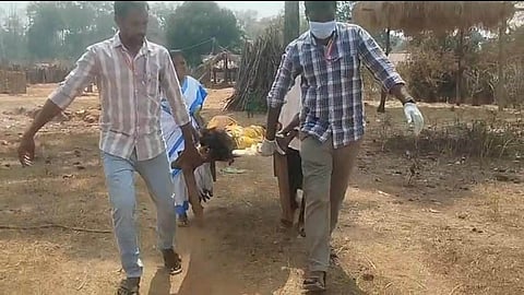 A pregnant woman being carried on cots in remote villages of chinturu tribal areas in Polavaram district due to lack of roads even after 79 years of independence.