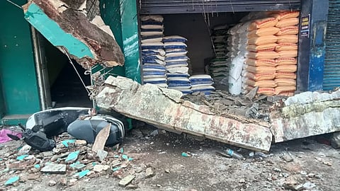 The fallen debris at the Valiyangadi market in Kozhikode after a concrete sunshade slab collapsed from an ageing building, killing two persons and injuring three others on Monday.