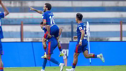 Braian Emmanuel Sanchez (top) of BFC celebrates with others after scoring the first goal in the match against NEUFC at the Sree Kanteerava Stadium in Bengaluru on Sunday.