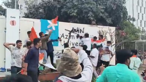ABVP activists smeared black ink on the university’s name board as a mark of protest.