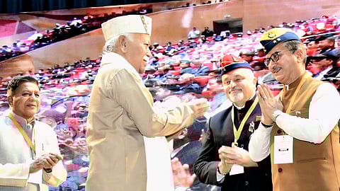 RSS chief Mohan Bhagwat being greeted at the event.