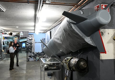 The remains of a Russian cruise missile KH-101 (R) are on display during a press presentation of the "Ukraine Museum" in the "Berlin Story Bunker" on February 23, 2026 in Berlin.