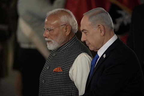 Israel's Prime Minister Benjamin Netanyahu, right, welcomes Indian Prime Minister Narendra Modi as he arrives at Ben Gurion Airport near Tel Aviv, Israel, Wednesday, Feb. 25, 2026.