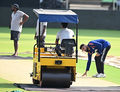 India spinner Varun CV checks the pitch at Chepauk on Wednesday
