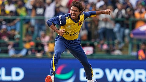 Sri Lanka's Dunith Wellalage celebrates the wicket of England's captain Harry Brook during the T20 World Cup cricket match between Sri Lanka and England in Pallekele, Sri Lanka, Sunday, Feb. 22, 2026.