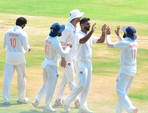 Auqib Nabi celebrates a wicket on Thursday