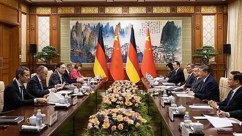 Chinese President Xi Jinping, second from right, meets with German Chancellor Friedrich Merz, second from left, at the Diaoyutai State Guesthouse in Beijing, China, Wednesday, Feb. 25, 2026.