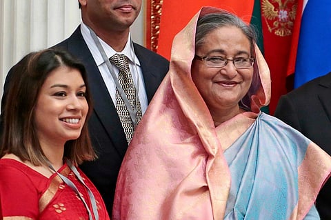 Tulip Siddiq, left, stands beside Bangladesh Prime Minister Sheikh Hasina in the Kremlin in Moscow, Russia, on Jan. 15, 2013. 