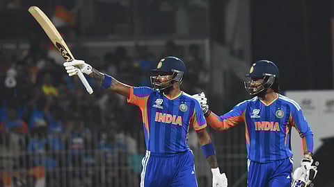 Hardik Pandya (R) celebrates his half-century with Tilak Varma on Friday