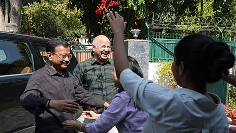 AAP national convenor Arvind Kejriwal and party leader Manish Sisodia celebrate with family members after a Delhi court discharged them in an excise police-related corruption case, refusing to take cognisance of the CBI chargesheet.