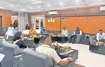 Members of the tribunal and other officials during the review meeting