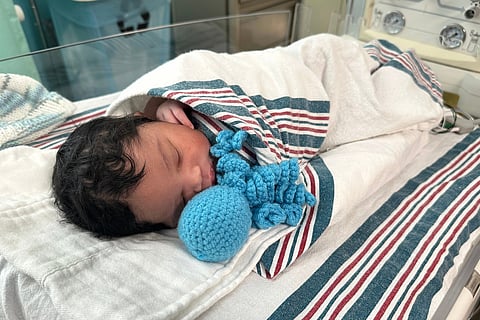 Newborn Tayshaun Nelms Jr. rests with an amigurumi octopi at the Children's Hospital of Michigan Neonatal Intensive Care Unit at DMC Hutzel Women's Hospital in Detroit, Thursday, Feb. 26, 2026. 