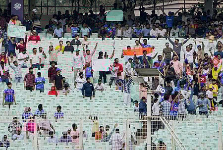 Fans cheer during the ICC Men's T20 World Cup 2026 cricket match between Italy and West Indies, at Eden Gardens, in Kolkata,