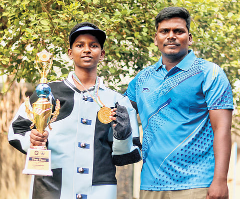 Perarivaalan stands next to his coach, James Raja, with his prize after bagging the first place in SGADF National Games held in Karaikal in December 2025 