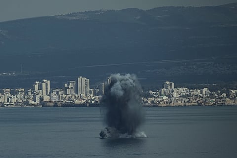 An incoming projectile explodes over the water as Israel issues a nationwide alert following its strikes on Iran, in Haifa Bay, northern Israel, Saturday, Feb. 28, 2026. 