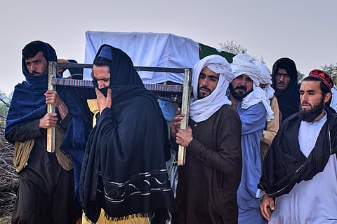 People carry the coffin of an army soldier, killed in the cross-border clashes of Pakistan and Afghan forces, for his funeral prayer at a village in Lakki Marwat, a district of Pakistan's Khyber Pakhtunkhwa province, Saturday, Feb. 28, 2026.