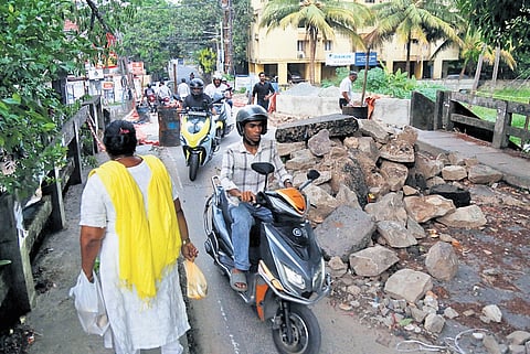 Reconstruction of the bridge on Sastha Temple Road is moving at a snail pace, and without this ‘shortcut’ link in Kaloor, motorists are in much distress 