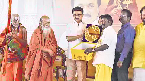 CM MK Stalin distributing assistance to village temple priests during a conference  organised by HR&CE Department in Chennai on Saturday