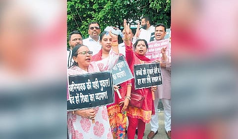Parents protest fee hike by private schools in Delhi.