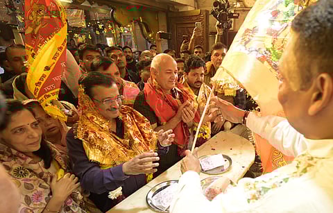 AAP national convener Arvind Kejriwal with party leader Manish Sisodia offers prayers at the Hanuman Temple in New Delhi.