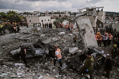 Rescue workers and military personnel operate at the scene where several people were killed in an Iranian missile strike in Beit Shemesh, Israel Sunday, March 1, 2026. 