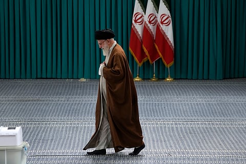 Iranian Supreme Leader Ayatollah Ali Khamenei arrives to vote for the parliamentary runoff elections, in Tehran, Iran, May 10, 2024.