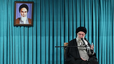 In this photo released by the official website of the office of the Iranian supreme leader, Supreme Leader Ayatollah Ali Khamenei speaks under a portrait of the late revolutionary founder Ayatollah Khomeini, in a ceremony meeting a group of officials, in Tehran, Iran, March 8, 2025.