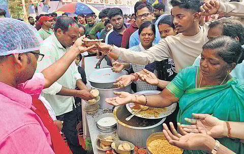 People gather at a stall selling Dahibara Aloodum at Balijatra ground, on Dahibara Diwas 