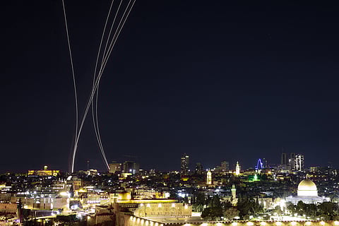 Rocket trails from an interception by Israel's Iron Dome missile defence system are pictured over Jerusalem on March 1, 2026.