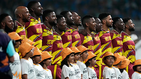 West Indies' players stand up for the national anthems before the start of the T20 World Cup cricket match between India and West Indies in Kolkata, India, Sunday, March 1, 2026.