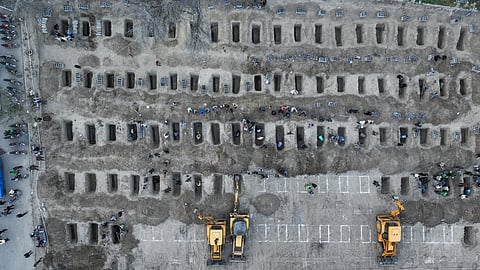 In this aerial handout picture released by the Iranian Press Center, mourners dig graves during the funeral for children killed in a reported strike on a primary school in Iran’s Hormozgan province in Minab on March 3, 2026.