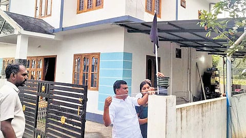 Gudalur MLA Pon Jayaseelan hoisting a black flag at his residence .