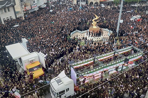 Residents and officials attend the funeral of people killed in what Iranian officials said was an Israeli-U.S. strike Feb. 28 on a girls' elementary school in Minab, Iran, Tuesday, March 3, 2026.