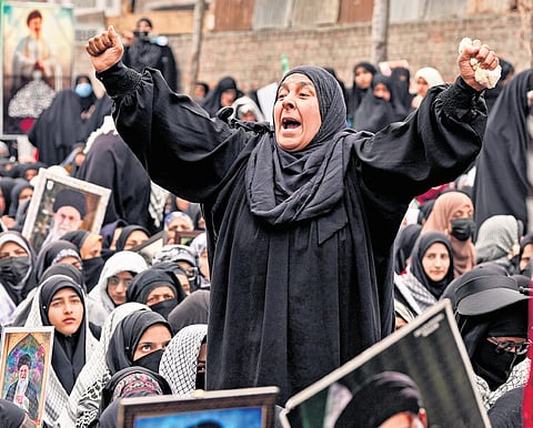 People raise slogans during a protest against the killing of Iran’s late Supreme Leader Ayatollah Ali Khamenei, while defying curfew-like restrictions imposed on third consecutive day in Budgam district, Jammu and Kashmir on Wednesday.
