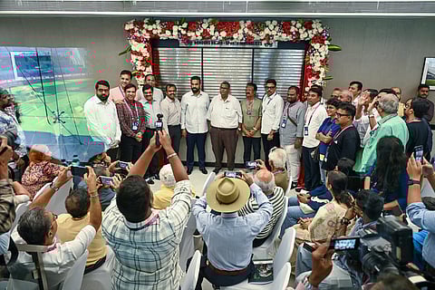 Dignitaries pose with the new honours board in the press board on Wednesday