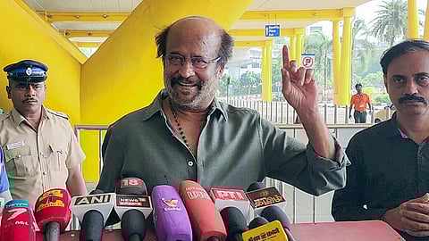 Actor Rajinikanth speaks to the media outside the Chennai airport.