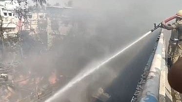 Fire tenders reach the spot as a massive fire breaks out at a shop in Madhyamgram, North 24 Parganas.