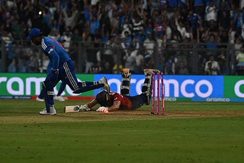 Jacob Bethell (C) getting run out by Sanju Samson (L)