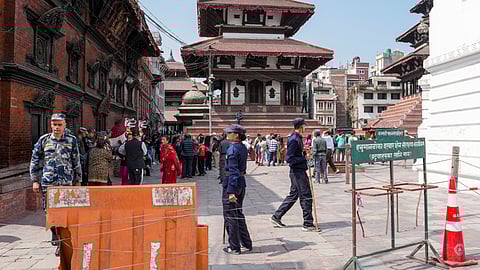 Security personnel keep vigil during voting in the Nepal general elections at a polling station in Lalitpur, Nepal, Thursday, March 5, 2026.