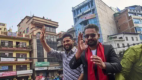 Balendra Shah, right, former mayor of Kathmandu Metropolitan City and prime ministerial candidate of the Rastriya Swatantra Party, joins Rabi Lamichhane, left, the party's president, during an election campaign rally in Lalitpur, Nepal, Saturday, Feb. 28, 2026.