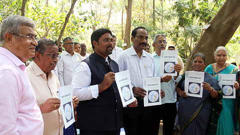 VMRDA Commissioner N Tej Bharath unveils the silver jubilee souvenir commemorating the 25th anniversary of DNCS Park in Vizag 
