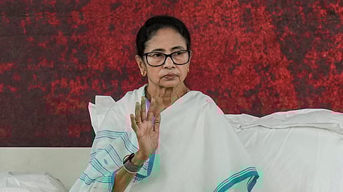 West Bengal Chief Minister Mamata Banerjee stages a sit-in to protest against the alleged arbitrary deletions from the post-SIR electoral rolls in the state, in Kolkata, Friday, March 6, 2026.
