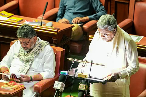 Karnataka Chief Minister Siddaramaiah, who also holds the Finance portfolio, presents the state Budget for the financial year 2026-27, at Vidhana Soudha, in Bengaluru.